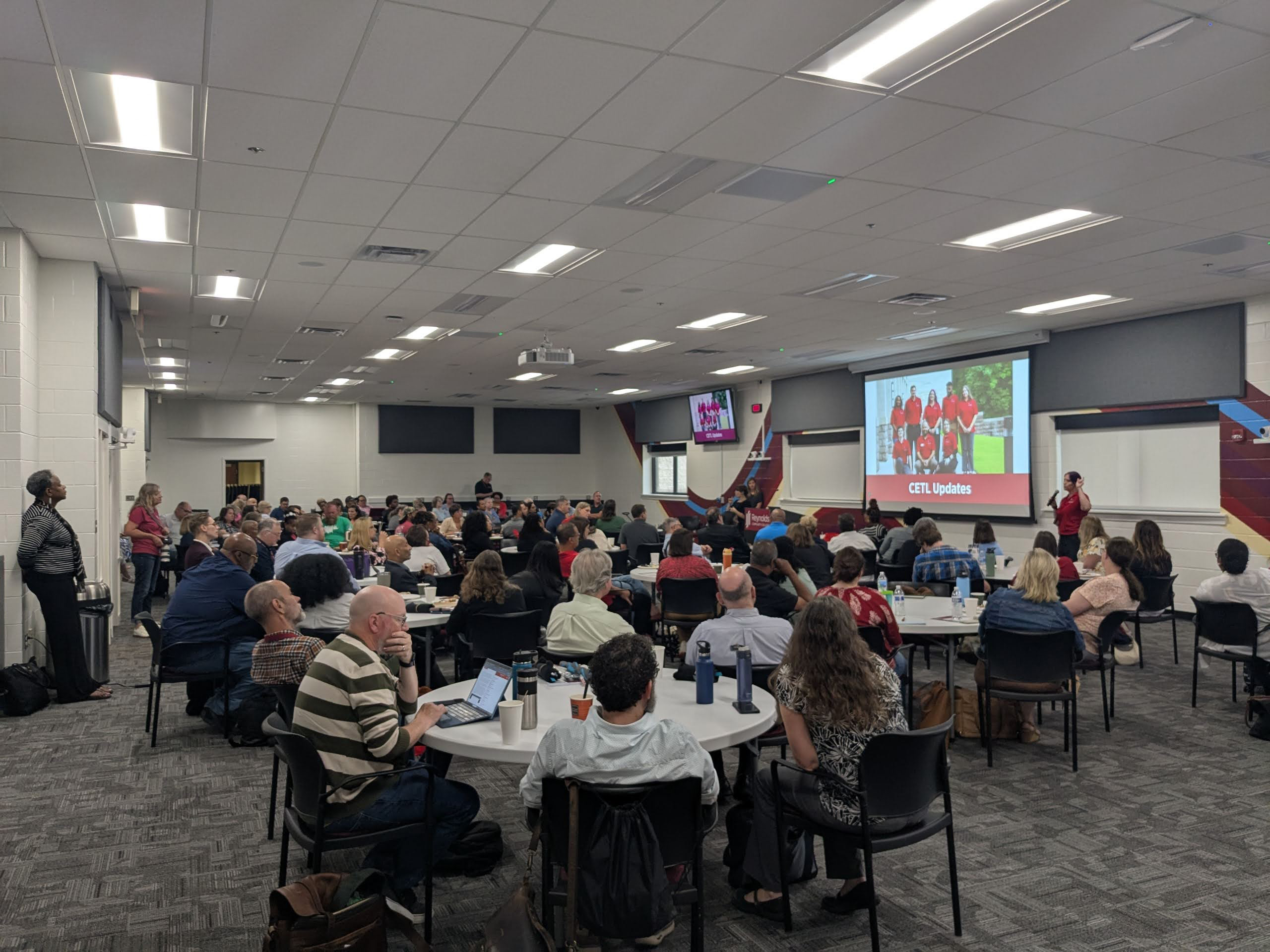 Faculty sitting together at a round table