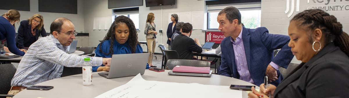 Faculty sitting around table