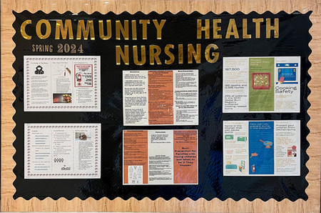 Community Health bulletin board at the Evan-Haynes Burn Clinic at VCU, featuring student projects – PSAs on Fire safety, burn prevention, and cooking safety.