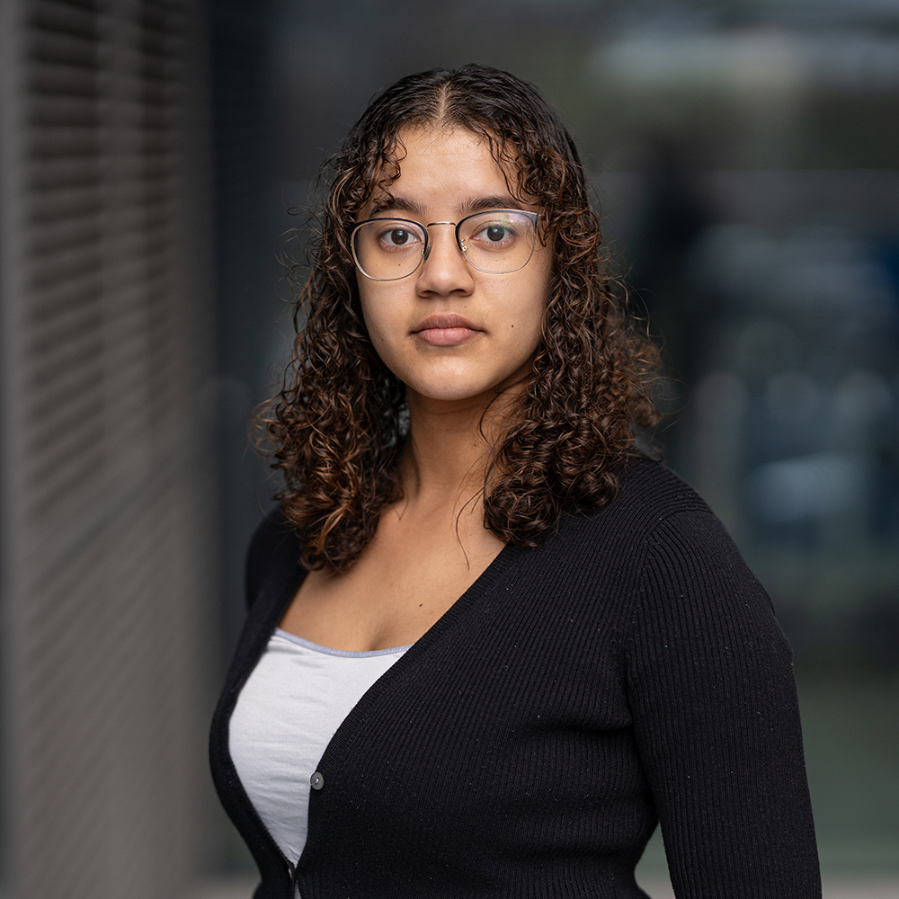 Raven Witherspoon, young lady with glasses, poses for camera