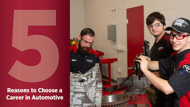 Promotional image showing mechanics working on a transmission or engine component, with a large red number '5' and text reading 'Reasons to Choose a Career in Automotive' on the left side.