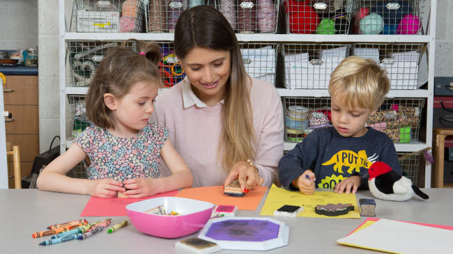 Student teaching 2 children.