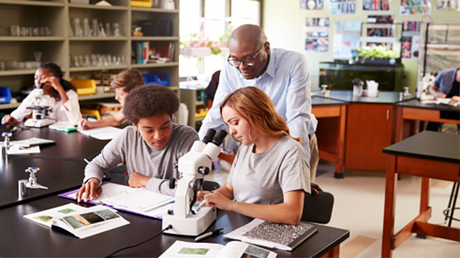 A group of students conducting experiments in a science lab.