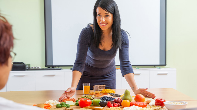 A woman teaching health and nutrition.