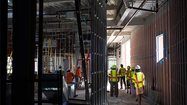 Students visit the constructions site of The Kitchens at Reynolds.