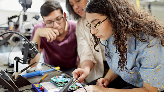 Students working on a computer.